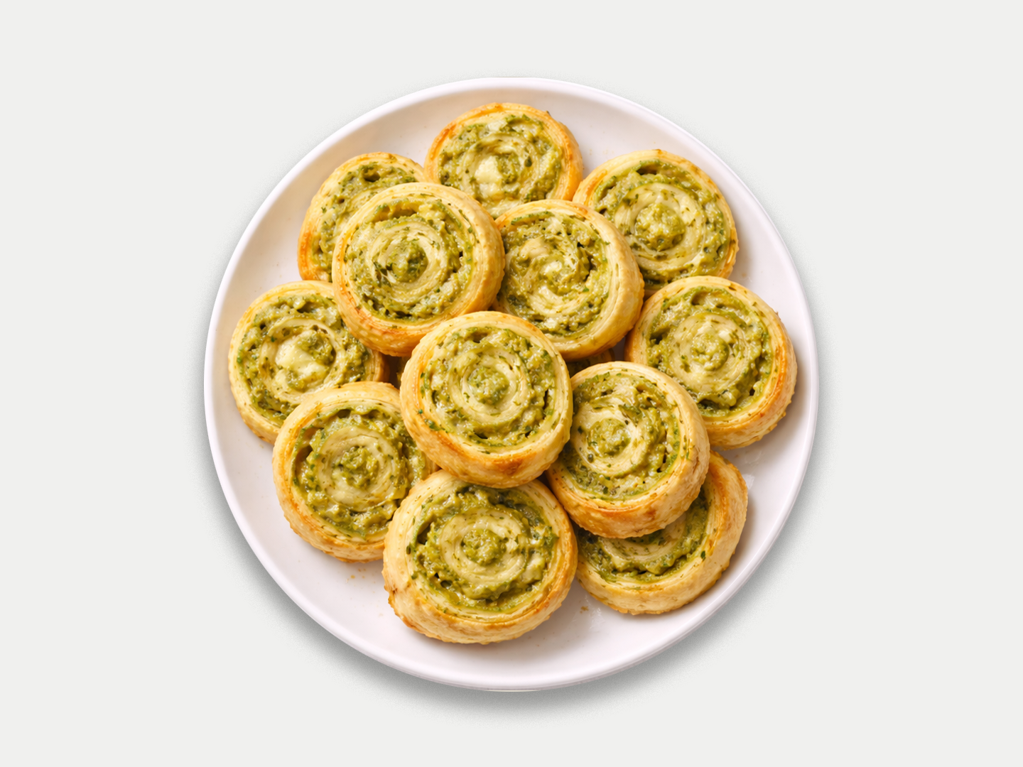 Girelle di sfoglia al pesto e svizzero